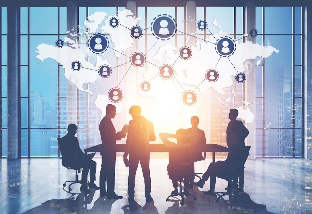 Silhouettes,Of,Business,People,Near,A,Table,In,A,Meeting